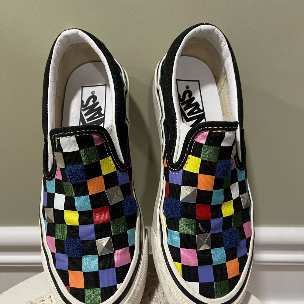 Vans slip on sneakers.